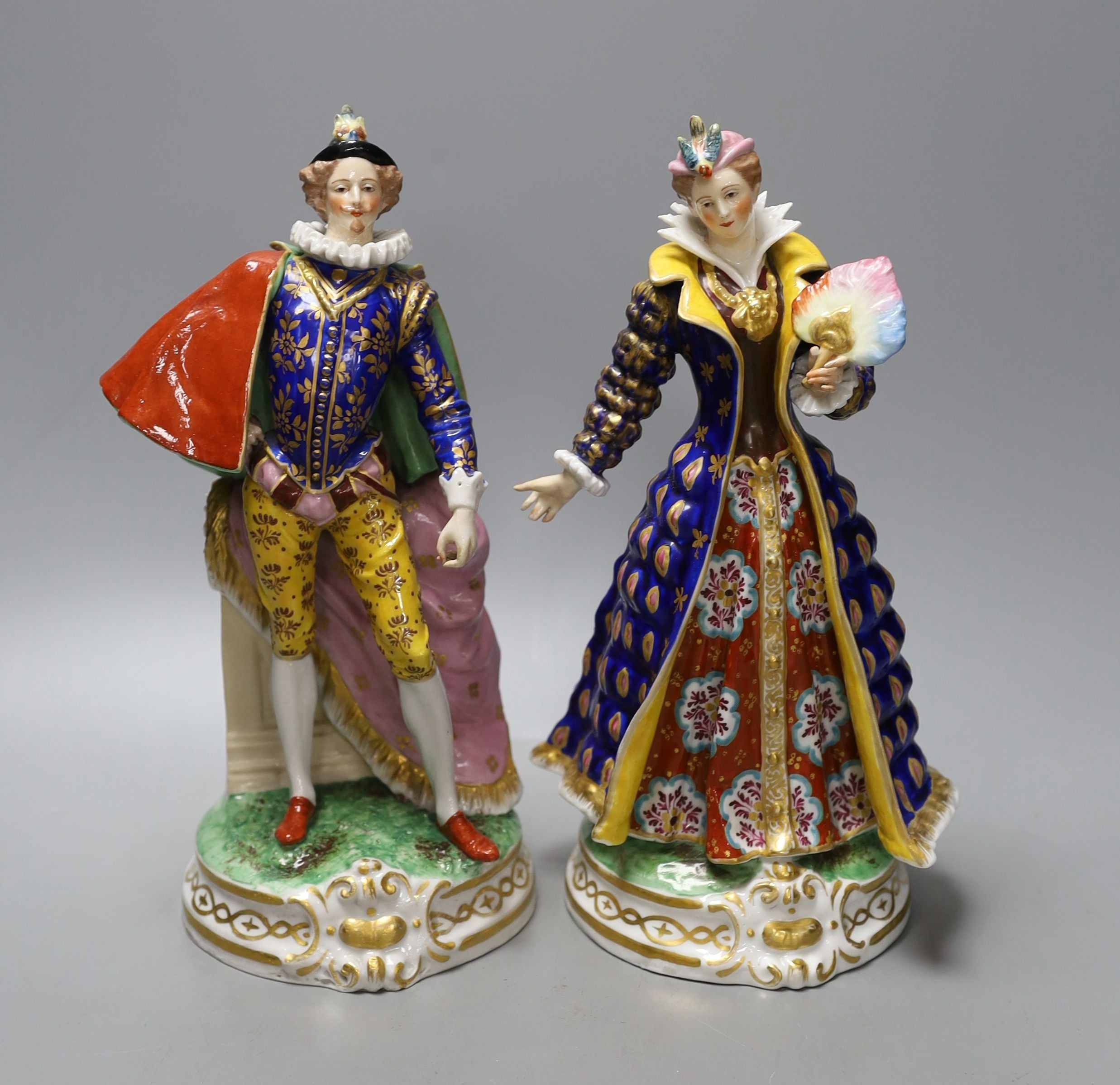 A pair of French porcelain court figures - 25cm tall